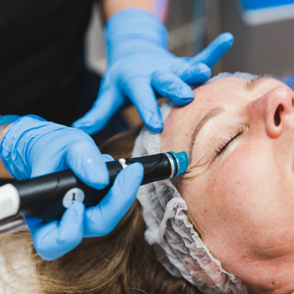 woman relaxes while receiving a hydrafacial in west linn